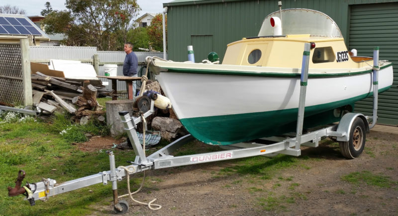 classic huon pine fishing boat and trailer. wooden boat
